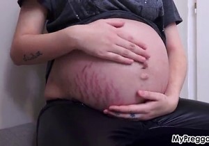 Lingerie-wearing blonde shows her soft belly here